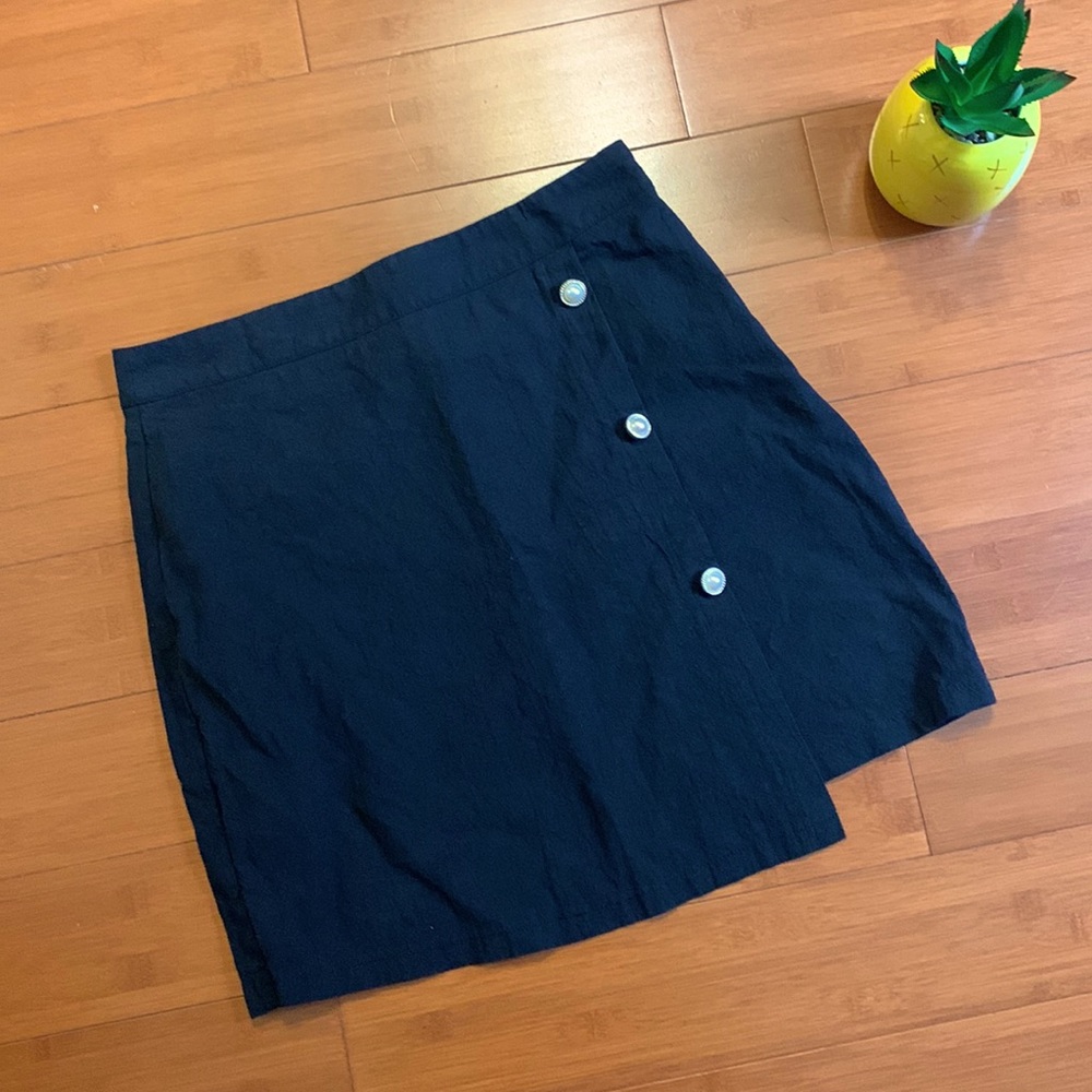 Black mini skirt with faux button detail